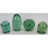 Four 19th century green glass end of day dump weights, each with snapped Pontil bases. Tallest 14cm.