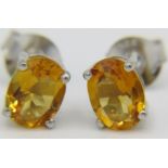 A pair of silver citrine stud earrings, post backs. Condition report: Good condition.