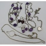 A silver hallmarked fob/glasses chain, a silver heart shaped locket on a chain and two purple