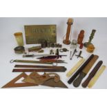 A mixed lot of antique collectables including troy oz weights and scale, sovereign scales, rulers,