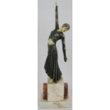 An Art Deco style figure of a dancer in the style of Chiparus mounted on a marble plinth. Height