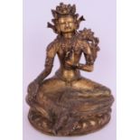 A fine antique gilt bronze Buddha figure of Tibetan deity Tara seated on a lotus leaf base. The base