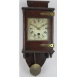 An Antique wall clock with silvered dial in later bracket style Mahogany case. Pendulum present.