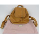 A Radley tan flap top backpack handbag in grained hide. Original paperwork and dust bag. All