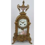 A 19th century gilt French striking mantel clock with hand decorated porcelain, enamel dial and Japy