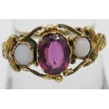 A pretty Georgian gold amethyst ring, 6mm x 8mm approx, mounted either side by opals, size R, no