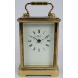 A brass cased Angelus 8 day carriage clock with 11 jewel movement, original packaging, paperwork and