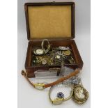 An old jewellery box (worn) with a quantity of costume jewellery to include a filigree pearl brooch,