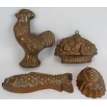 Four decorative vintage copper jelly moulds including a fish, cockerel, fruit basket and pineapple