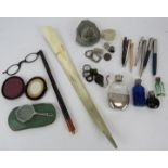 A mixed lot of collectables including pens, perfume bottles, lorgnettes, fossils, shoe horn,