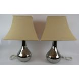 A pair of contemporary White Company chrome effect lamps with square cream shades. Overall height
