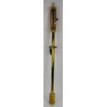 A brass gimbal mounted stick barometer with silvered gauge. No maker's marks. Height 98cm. Condition