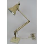 An original Anglepoise lamp by George Cawardine for Herbert Terry & Sons. Cream with two step base