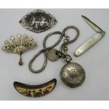 A collection of silver to include a silver sovereign holder, three silver brooches (eastern) and a