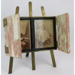 A 19th century easel style photo frame with pink marble doors, gilt ornate hinges and brass easel.