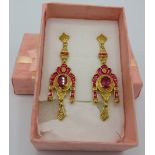 A pair of African ruby earrings, decorative enamelling, 50mm length, yellow gold/925. Condition