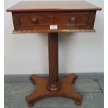 A Victorian mahogany work table with cock-beaded single drawer, on a tapering octagonal pedestal and