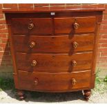 An early Victorian mahogany chest of two short over three long graduated drawers with original