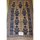 A small Persian rug blue on cream ground. Condition okay. 125cm x 75cm (approx).