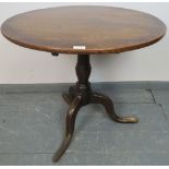 A Georgian oak circular wine table, on turned pedestal with outswept tripod base. Condition