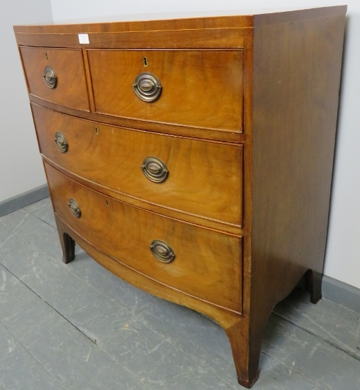 A Regency Period bow fronted mahogany chest of two short over two long graduated cock-beaded - Image 2 of 3