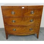 A Regency Period bow fronted mahogany chest of two short over two long graduated cock-beaded