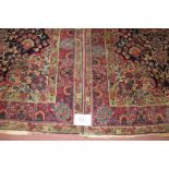 Antique Persian rugs, a near pair of Persian rugs c1900-1920 central flower medallion red on green