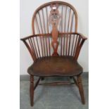 A Georgian elm and yew wood hoop-back Windsor chair of excellent colour, on turned supports with