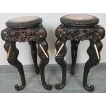 A pair of antique tropical hardwood jardinieres/plant stands with inset red marble tops, the