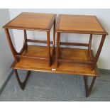 A set of three rectangular Astro crossbanded teak nesting tables by G Plan, on curved supports