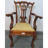 A vintage mahogany child?s chair in the Chippendale taste, with acanthus carving, on claw & ball