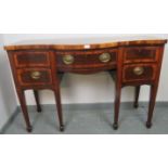 A George III mahogany serpentine front sideboard, inlaid and crossbanded, with central long drawer