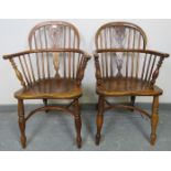 A pair of Georgian elm and yew wood hoop back Windsor chairs of excellent colour, with shaped and