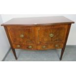 An Edwardian flame mahogany sideboard with reeded edge, housing one cupboard and one deep drawer