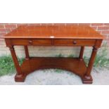 A Victorian mahogany console table/writing desk with two cock-beaded short drawers, on four tapering