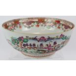 A large 18th century Chinese porcelain bowl decorated in coloured enamels depicting European hunting