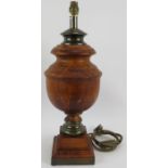 A large turned wood table lamp of baluster form with patinated brass mounts. Height 54cm.