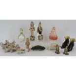 A mixed lot of antique ceramic figures including a pair of Majolica figurines, a continental