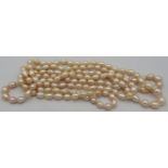 Freshwater peach pearl necklace, long line 60" continuous length, individually hand knotted.