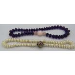 A white circle pearl necklace with large ball 'Cliclasp' set with many garnets & citrines and an