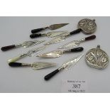 A collection of nine modern silver trowel shaped bookmarks and two small silver perfume bottles