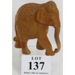 A finely carved hardwood Asian elephant. Height 19cm. Condition report: No issues. Tusks removed.