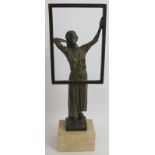 A contemporary bronzed sculpture of a woman at a window mounted on a stone plinth. Signed Miro,