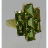 Peridot ring, octagon cut stones, a large 22mm x 15mm overall size, size P/Q, 14k yellow gold/925.