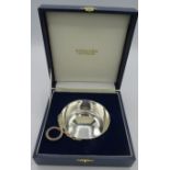 A silver wine taster with serpent handle, Sheffield 2001, approx weight 2.9 troy oz/90 grams, boxed.