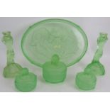 An Art Deco green uranium glass six piece 'Mermaid' dressing table set by Walther & Sohne. Tray 36cm