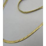 An 18ct yellow gold flat linked necklace & matching bracelet, a 9ct yellow gold necklet and a