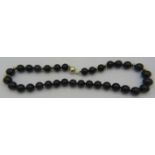 A black onyx necklace with yellow metal spacers on a 14ct yellow gold ball clasp, approx 18" long,
