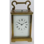 A good quality brass cased repeater carriage clock with enamel dial, marked Cheltenham, maker's name