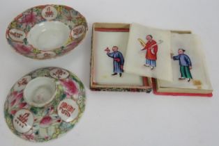 Two brightly decorated antique Chinese porcelain dishes, each having Chinese characters on the rims,